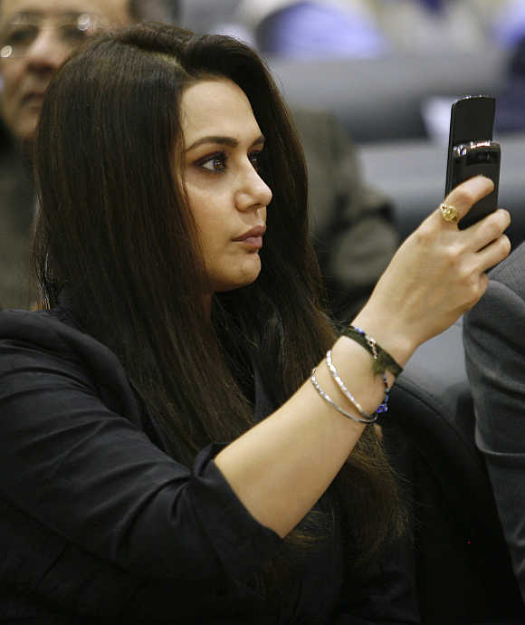 Actress Preity Zinta takes pictures with her mobile phone in Gandhinagar, Gujarat.