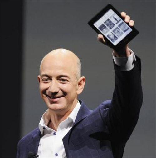 mazon CEO Jeff Bezos holds up a Kindle Paperwhite during Amazon's Kindle Fire event in Santa Monica, California.