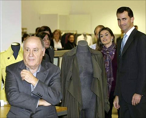 Spain's Princess Letizia and Crown Prince Felipe (R) stand next to chairman of Spanish global fashion group Inditex, Amancio Ortega (L), during a visit to an Inditex factory in Coruna, northern Spain.