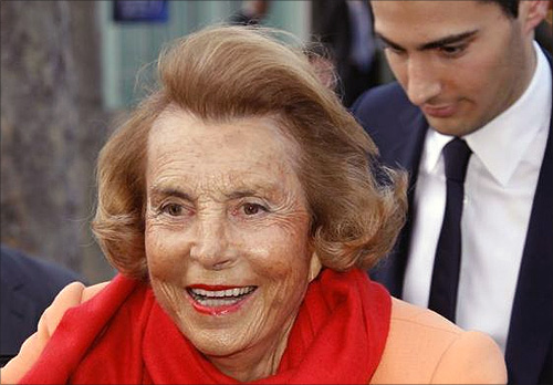 Liliane Bettencourt (L), heiress to the L'Oreal fortune leaves with Jean-Victor Meyers, her grandson, the L'Oreal-UNESCO prize for women in Paris.