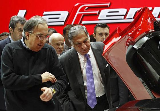 Ratan Tata and Fiat CEO Sergio Marchionne (L) inspect the new LaFerrari hybrid car.