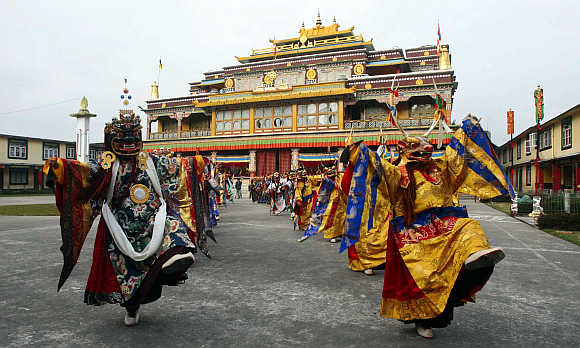 Buddhist monks perform chaam (masked) dance at Ralong village, about 76km south from Gangtok, Sikkim.