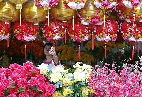 An ethnic Chinese Malaysian woman shops for decorations ahead of the Chinese Lunar New Year in Kuala Lumpur.