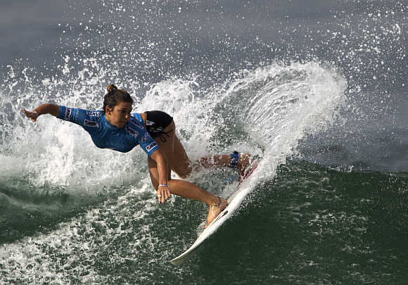 Coco Ho of Hawaii surfs at Barra da Tijuca beach in Rio de Janeiro.