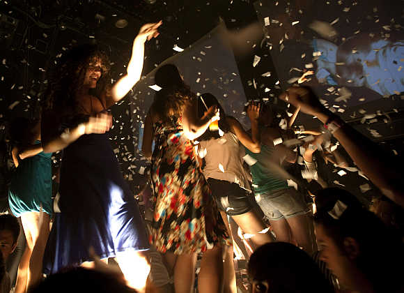 Spring breakers dance during a party at a bar in Cancun, Mexico.