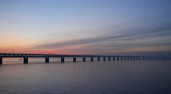 Cars travel along the 7,845 metres long Oresund Bridge, which links the city of Malmo in Sweden to Copenhagen, the capital of Denmark.