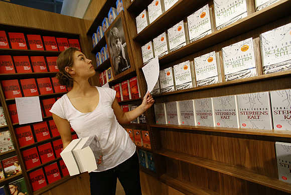 A woman sorts books at a book fair in Frankfurt, Germany.