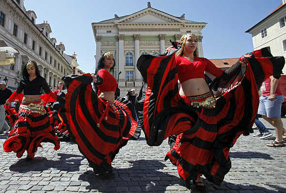 Participants of the Khamoro World Roma Festival dance through the historical centre of Prague, the Czech Republic.