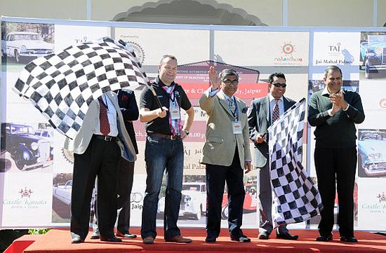 Brand director and head of Audi India Michael Perschke, on the left, flagging off the rally.