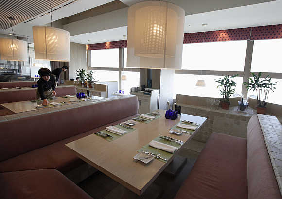 Staff work at the Marco Polo restaurant at the Grand Intercontinental Hotel in the Gangnam area of Seoul, South Korea.