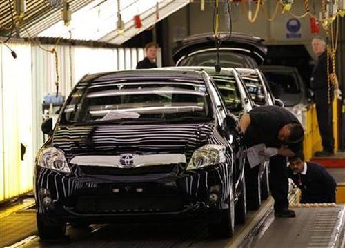 Cars are inspected at the end of the production line at the Toyota factory.
