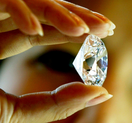 An employee holds the largest D colour internally flawless diamond for auction offered by Sotheby's Geneva in Hong Kong.