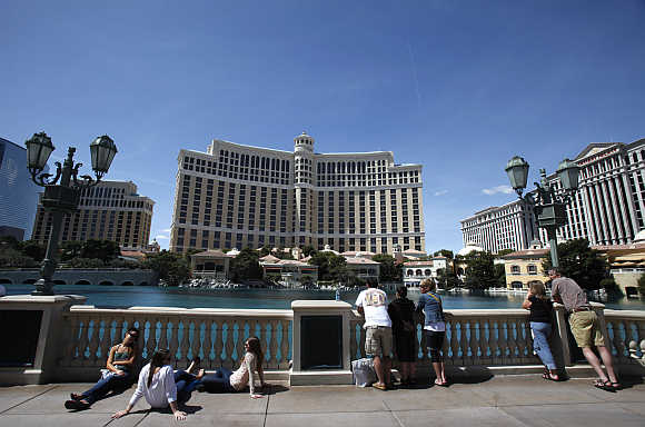 Tourists watch the Bellagio hotel in Las Vegas, Nevada, United States.