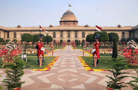 Guards stand in the Mughal gardens surrounding Rashtrapati Bhavan in New Delhi.