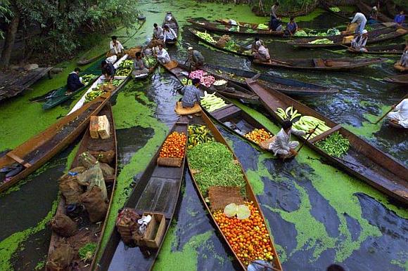 Kashmiri vegetable sellers gather at a floating market on Dal Lake in Srinagar.