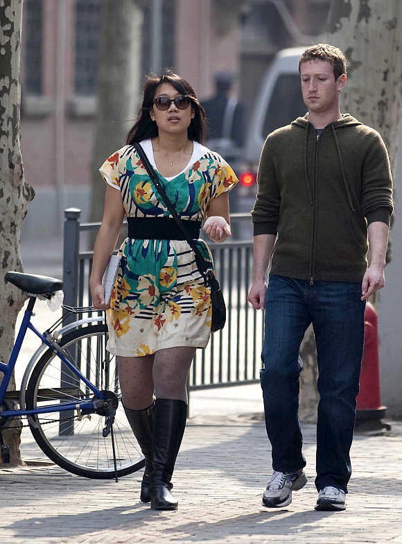 Facebook CEO Mark Zuckerberg with his wife Priscilla Chan walk near Fuxing Road in Shanghai, China.