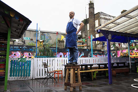 Leandro Virgilio, 37, poses in the backyard of his restaurant near Dublin city centre which becomes a bar and club in the evenings in Ireland.