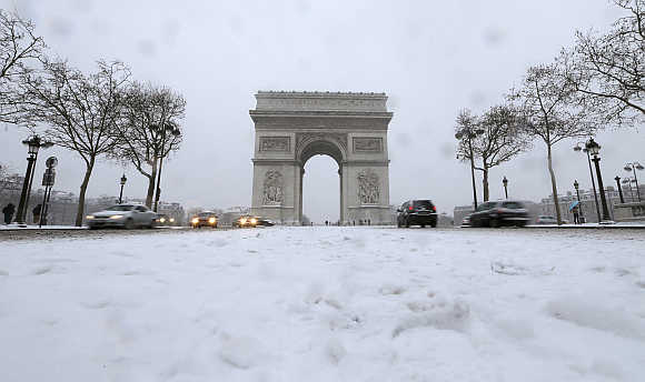 A view of Champs Elysees avenue and Arc de Triomphe in Paris, France.