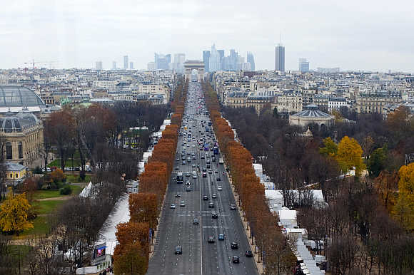 A view of Champs Elysees Avenue and Arc de Triomphe monument in Paris, France.