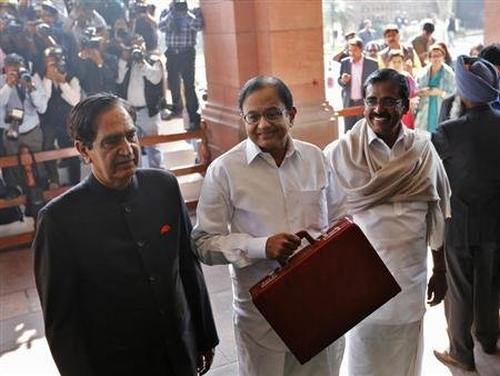 Finance Minister Palaniappan Chidambaram (C) at the parliament before presenting the 2013-14 Union Budget.