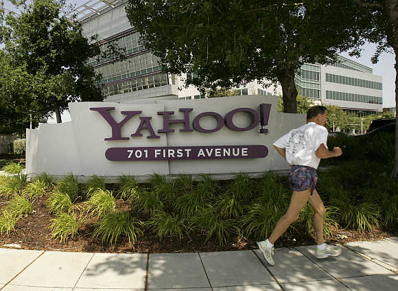 A man runs past the headquarters of Yahoo! in Sunnyvale, California.