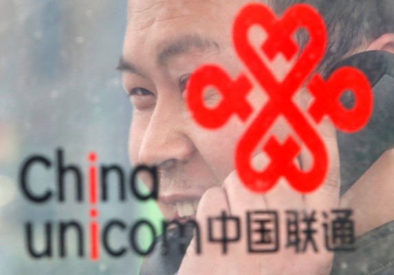 A man uses a China Unicom public telephone in Beijing.