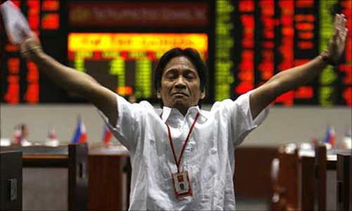 A trader at the Philippines stock exchange as business is halted.