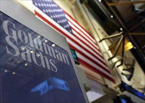 A Goldman Sachs sign is seen above their booth on the floor of the New York Stock Exchange.