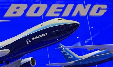 Models of Boeing 747 and 777 passenger planes are displayed at the Boeing booth.