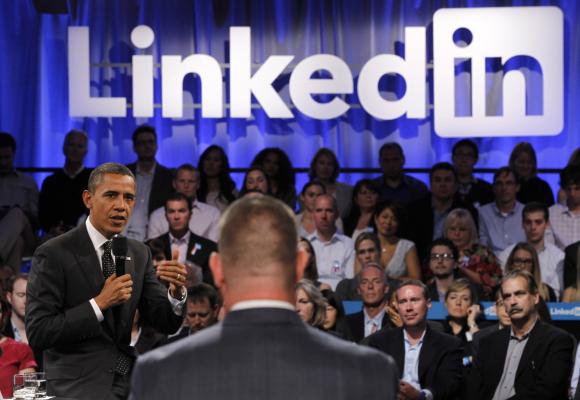 US President Barack Obama speaks to a participant who asked him a question during in a LinkedIn town hall-style meeting.