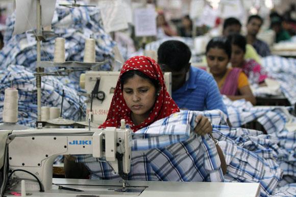 A worker sews inside a garment factory in Bangladesh.