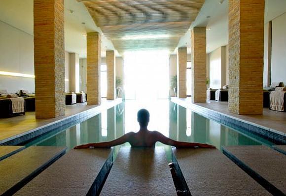 A woman relaxes in a spa.