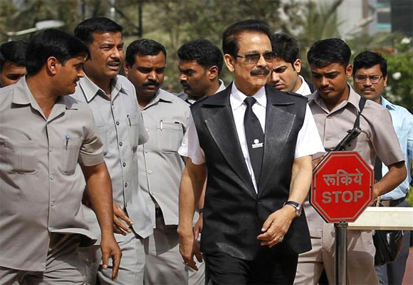 Subrata Roy accompanied by his security leaves the SEBI headquarters in Mumbai.