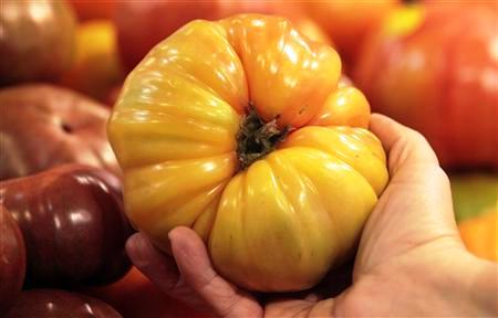 An organically grown Heirloom tomato is seen in the produce section at the Whole Foods grocery story in Ann Arbor, Michigan.
