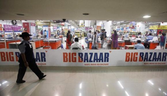 A security personnel walks past the Big Bazaar retail store in Mumbai.