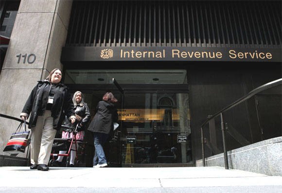 Women walk out of an Internal Revenue Service office in New York.