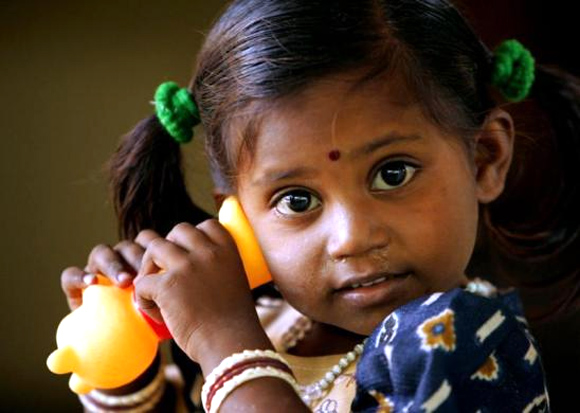Two-year-old Sneha plays with a toy at a government centre for tsunami orphans in Nagapattinam, in southern India.