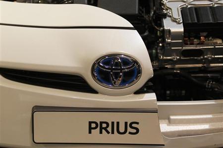 A logo of a Toyota Prius car is pictured at an exhibition stand of the 'International CAR Symposium' in Bochum.