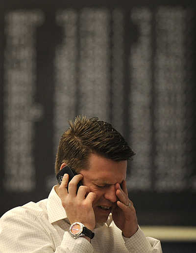 A share trader reacts at the German DAX stock exchange in Frankfurt, Germany.