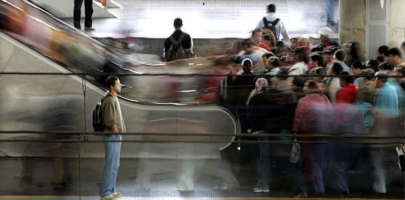 Thousands of commuters pack the Bras train station during rush hour in downtown Sao Paulo, Brazil.