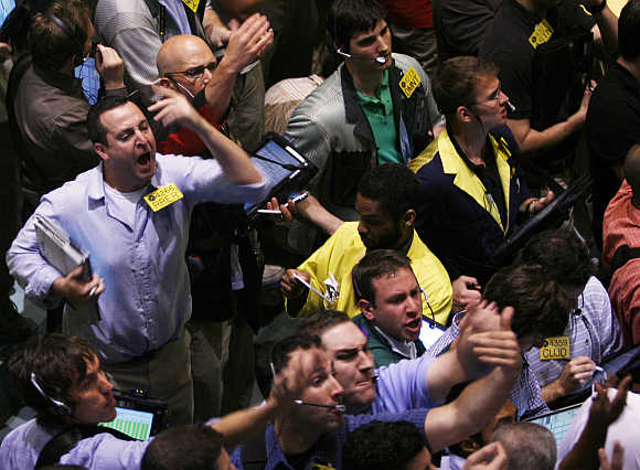 Traders work in the Crude and Natural Gas Options pit at the New York Mercantile Exchange, United States.