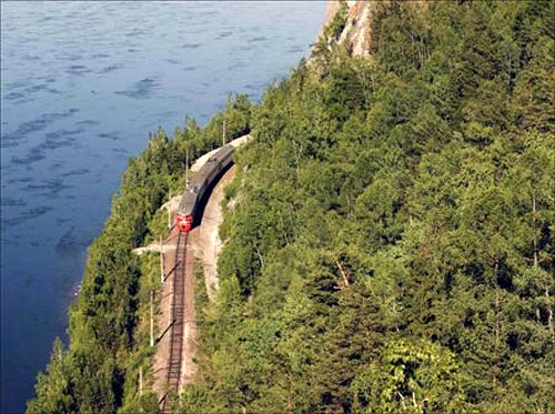 A train moves along the Trans-Siberian Railway through the Taiga district, some 90 km (56 miles) southwest of Russia's Siberian city of Krasnoyarsk.