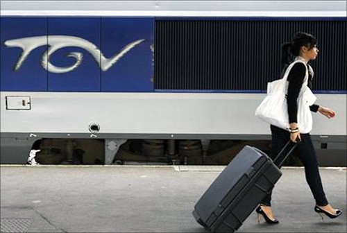 A commuter walks on a TGV train platform at Nantes's railway station.