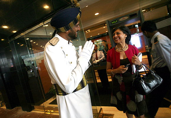 A gate attendant greets a guest.