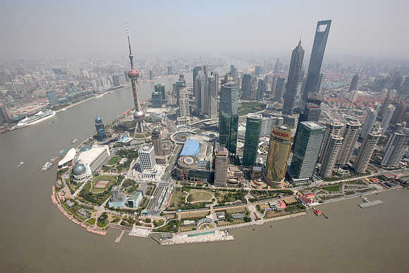 An aerial view shows Shanghai's financial district skyline along the Huang Pu river in China.