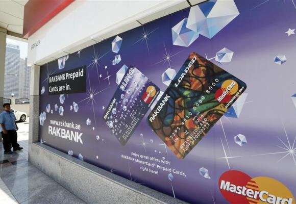 A sign displaying ATM prepaid cards is seen at a RAKBANK branch at Dubai Marina.