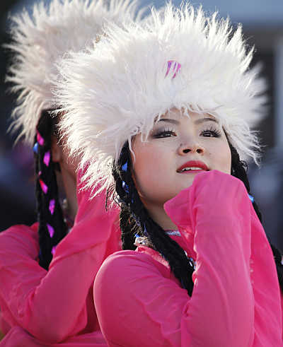 Women perform during the opening ceremony of the temple fair at Ditan Park in Bejing, China.