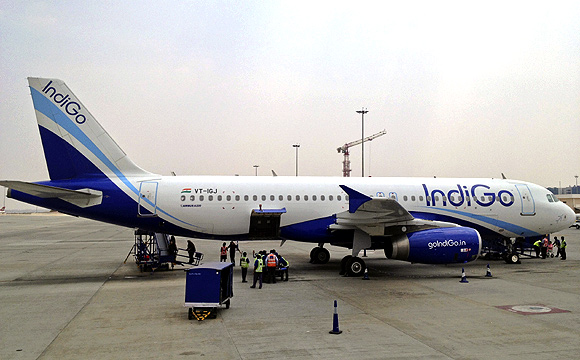 An IndiGo Airlines A320 aircraft is parked on the tarmac.