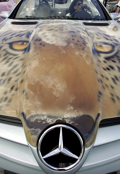 A person sits in a car during an airbrush car art show in Moscow.