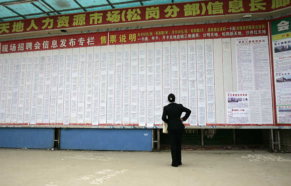 A job seeker looks for work at the near deserted Xintiandi employment centre, in Songgang town, Shenzhen, China.